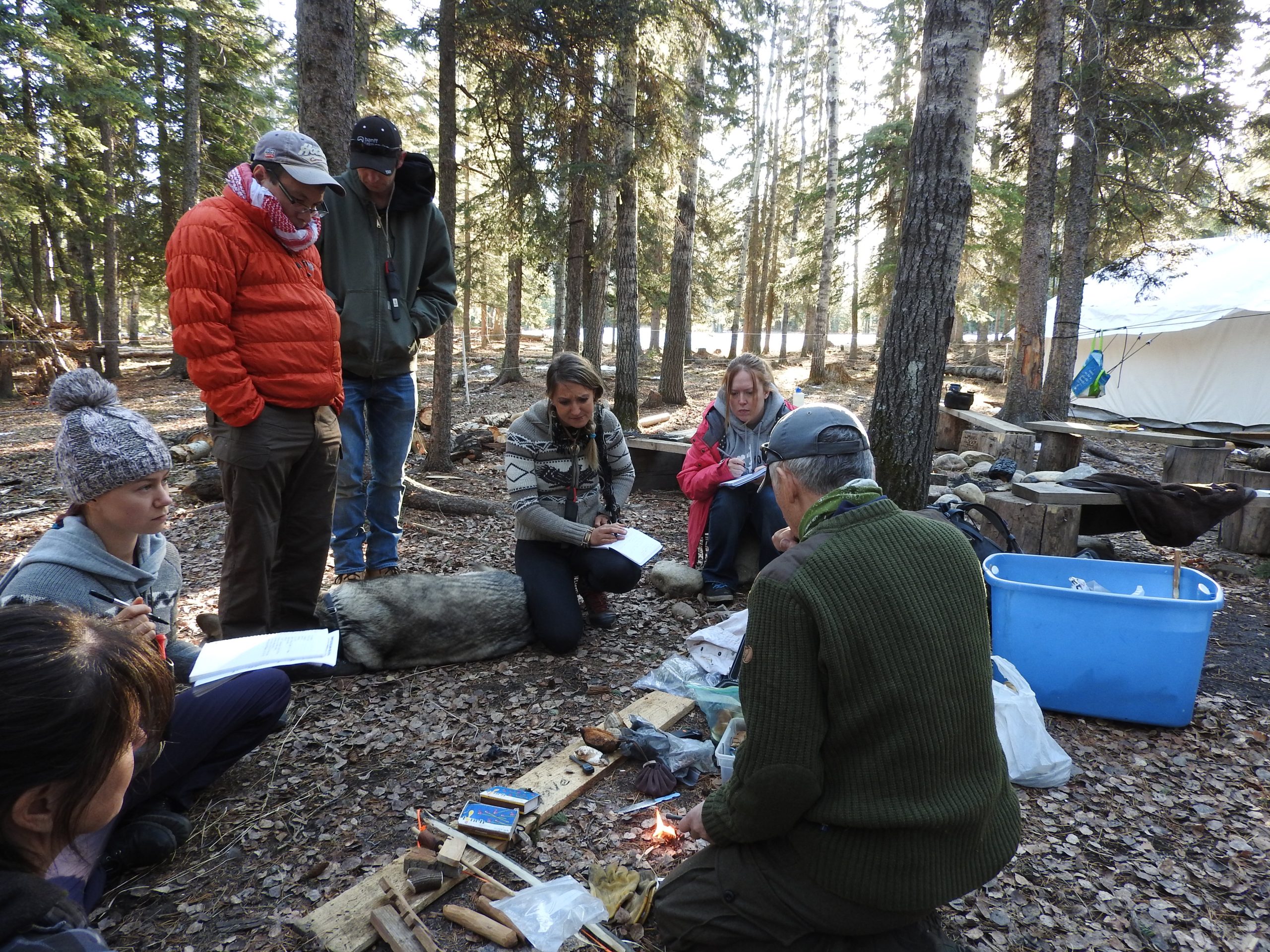 A first aid group sitting in a circle outside
